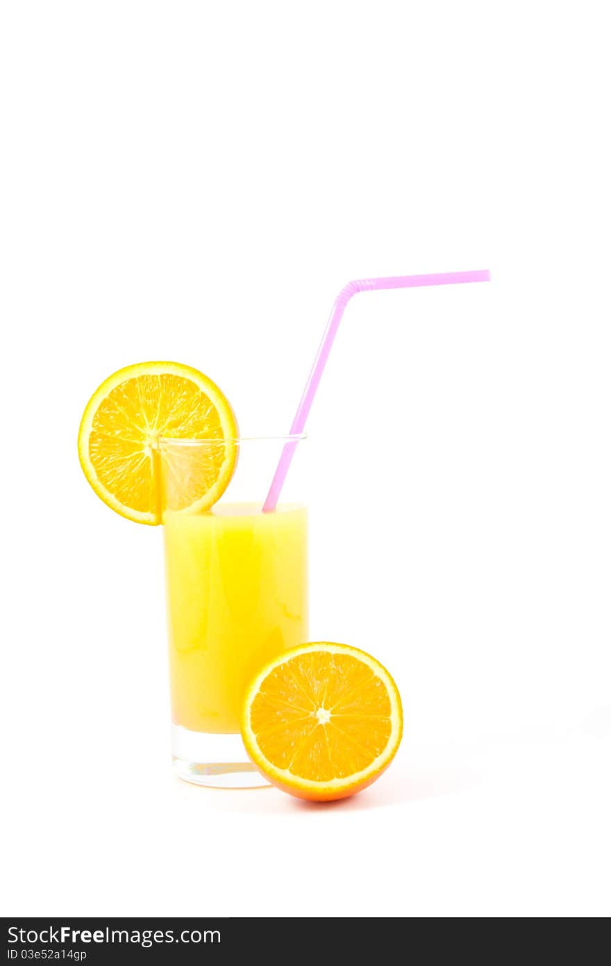 Fresh orange juice in a glass with drinking straw