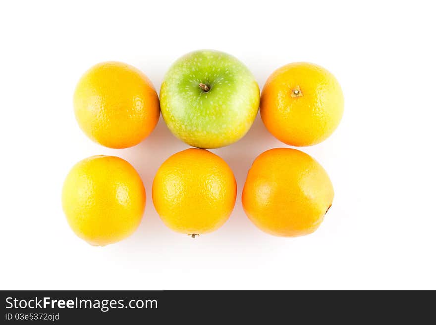 Five oranges and one apple isolated