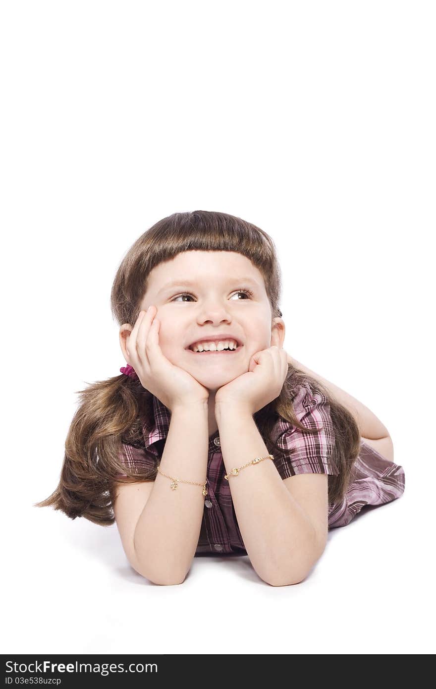 Little girl lying on the floor and smiling. Little girl lying on the floor and smiling