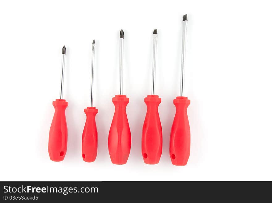 Red set of screwdrivers isolated on white