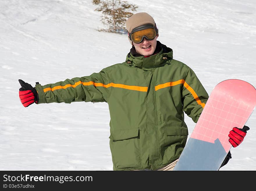 Young man with snowboard outdoors. Young man with snowboard outdoors