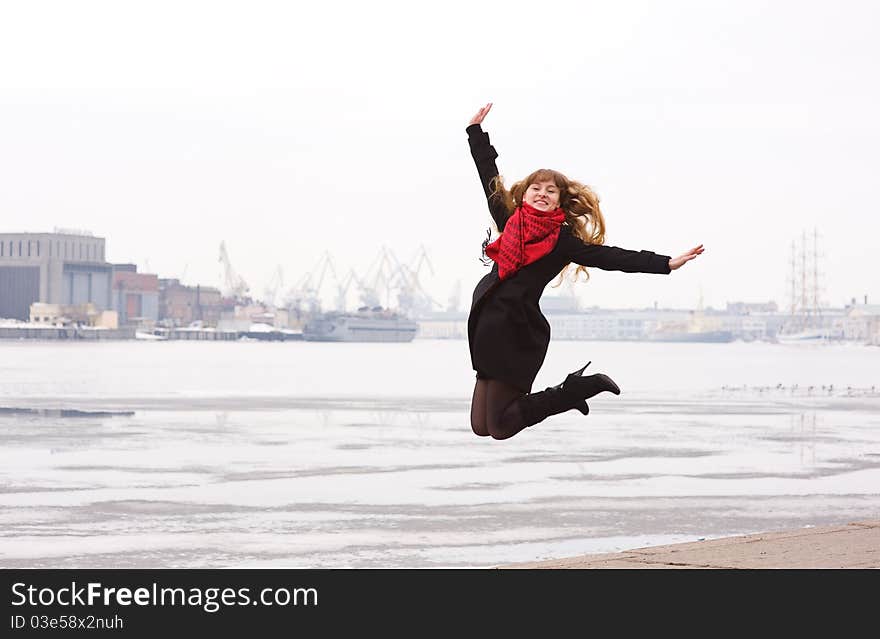 Happy young woman with long hair jumping. Happy young woman with long hair jumping