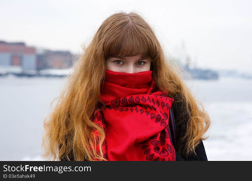 Girl with green eyes in the red scarf