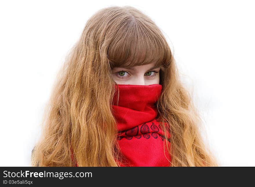 Beautiful girl with green eyes and long hair in the red scarf on the white background. Beautiful girl with green eyes and long hair in the red scarf on the white background