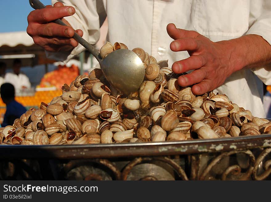 Cooking snails in the market in maroco