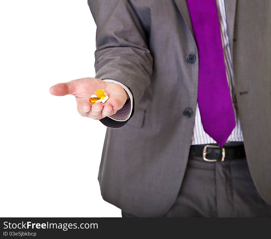 Man in suit holding pills isolated on white