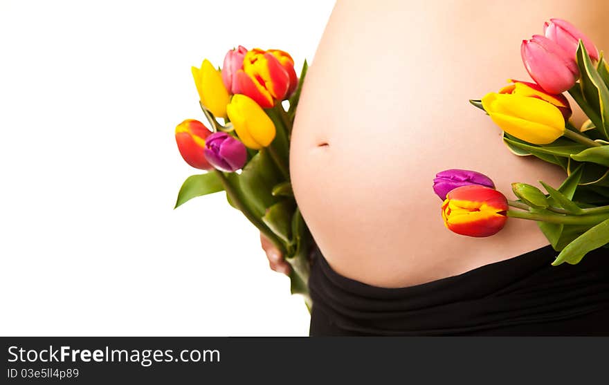 Pregnant woman belly with tulip  flowers