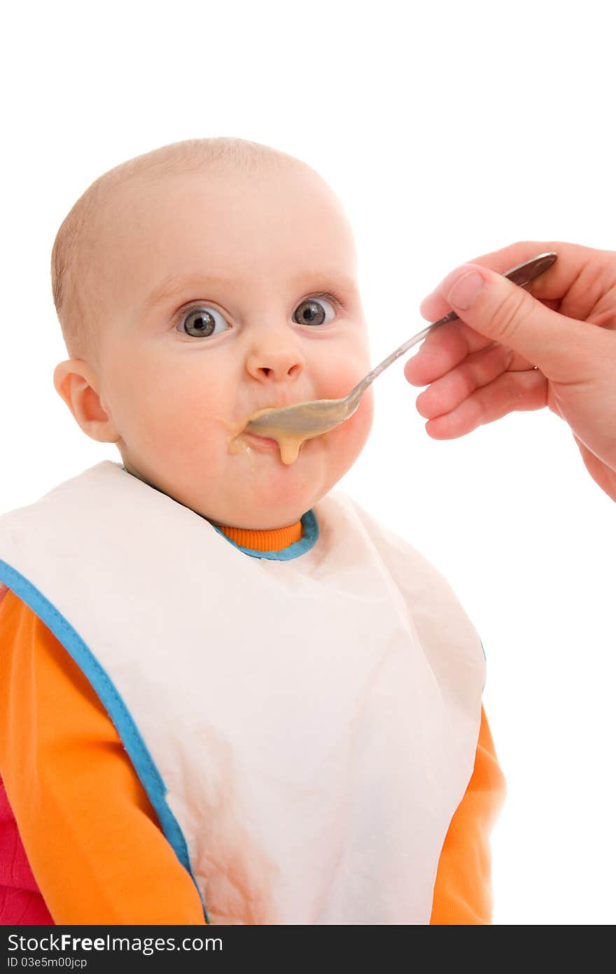 Kid eats on a white background. Kid eats on a white background.