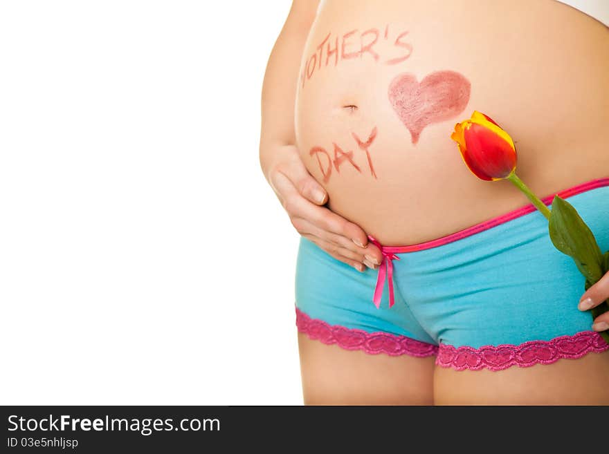 Pregnant woman belly with tulip flowers