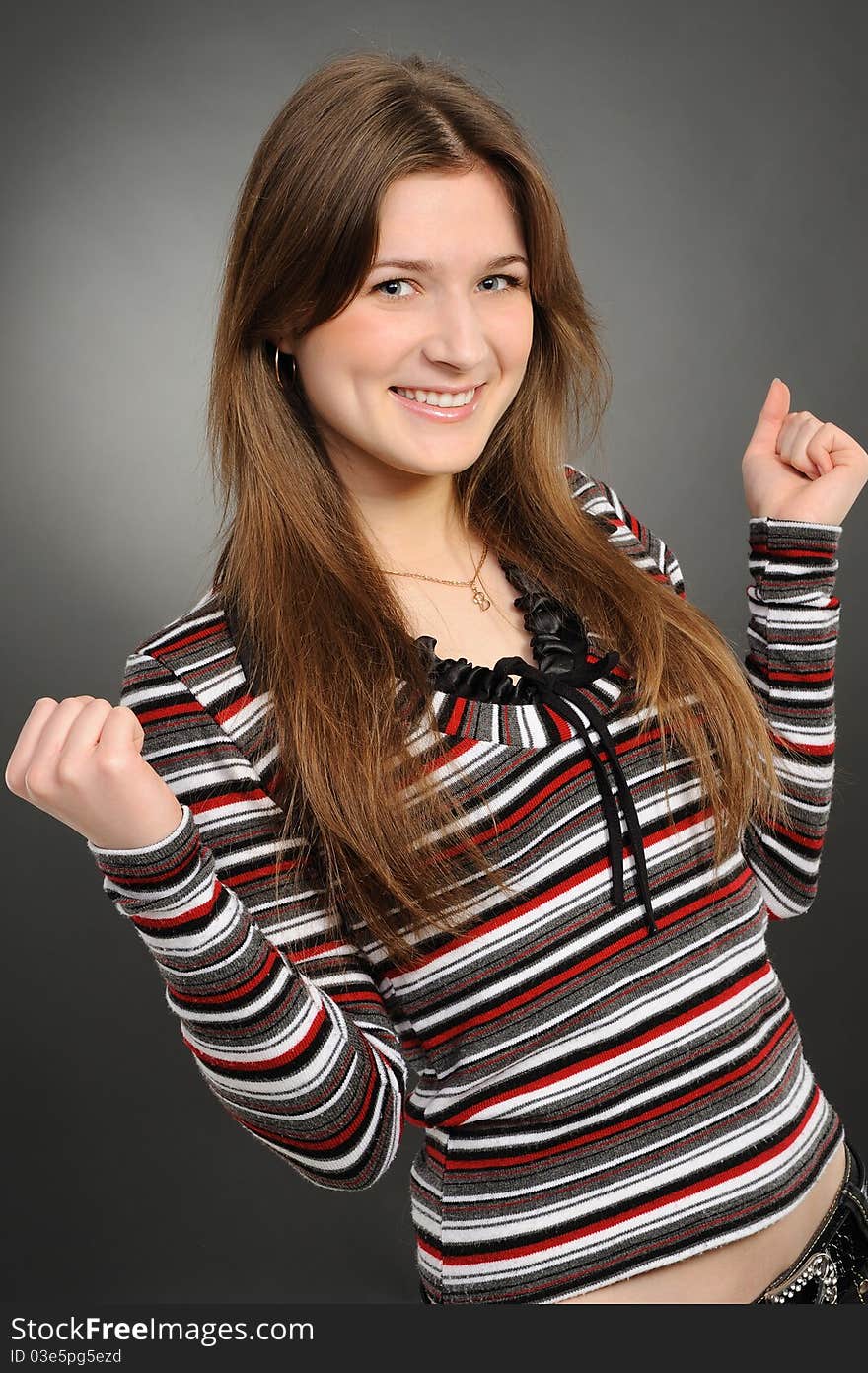 Excited youngwoman enjoying success