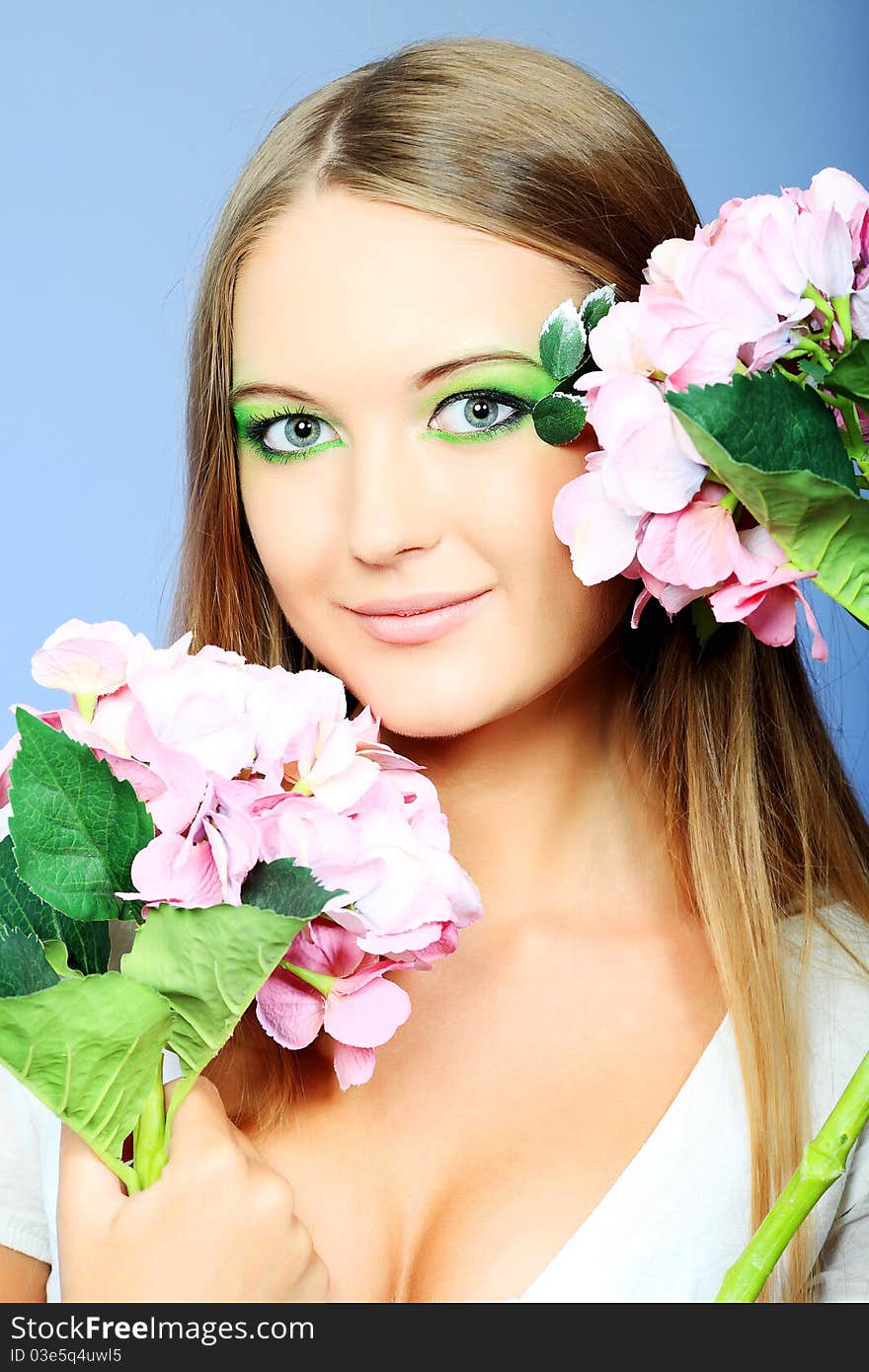 Portrait of a beautiful young woman with spring make-up. Beauty, fashion. Portrait of a beautiful young woman with spring make-up. Beauty, fashion.