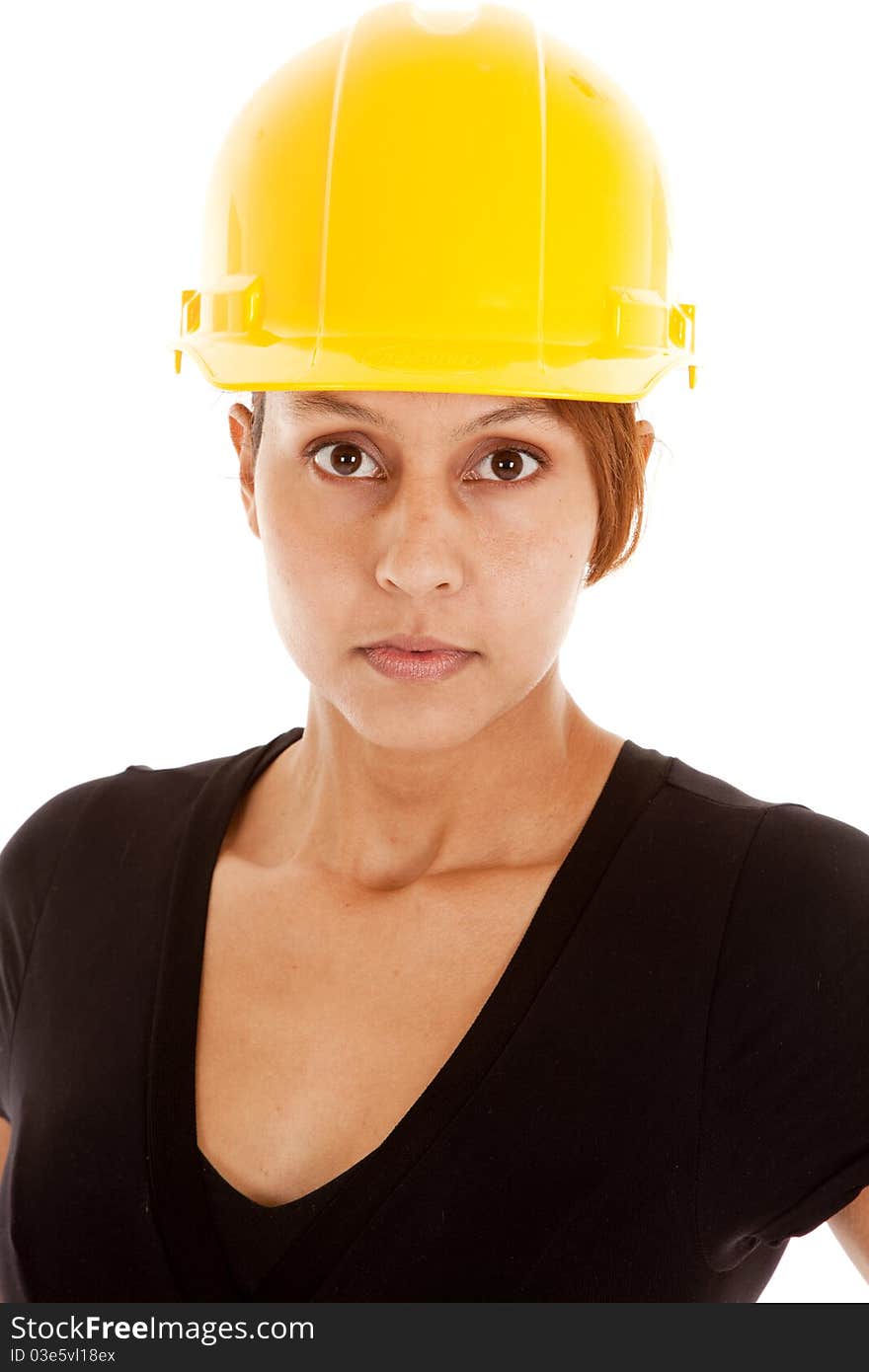 A close up of a woman in a yellow hard hat. A close up of a woman in a yellow hard hat.