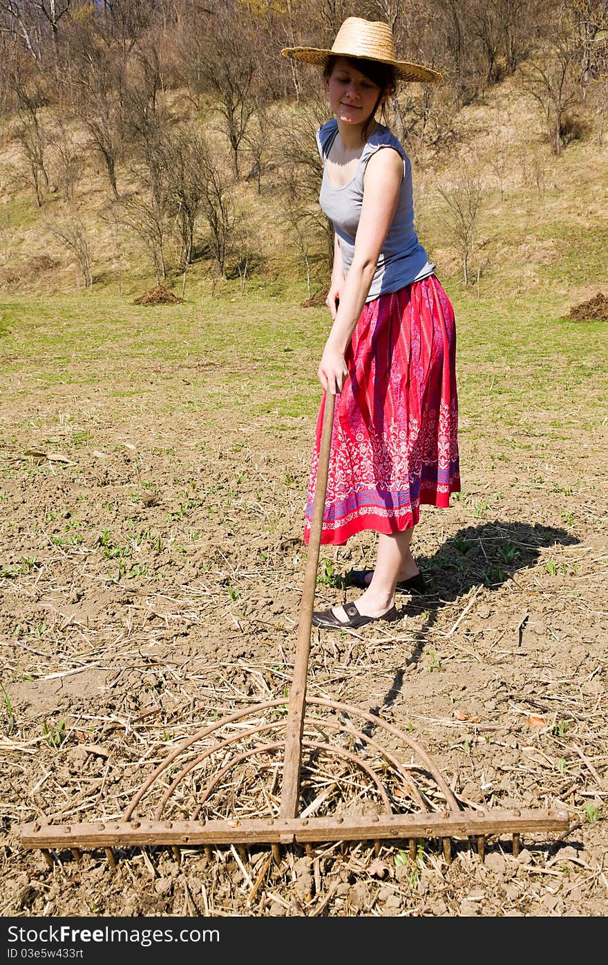 Young happy woman working in the garden. Young happy woman working in the garden