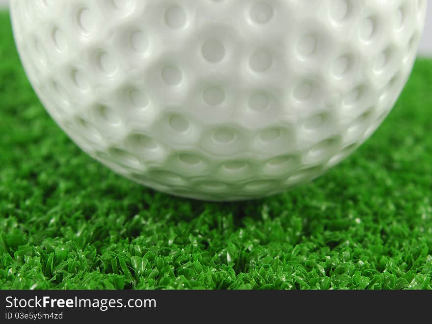 Golf ball on the green grass turf