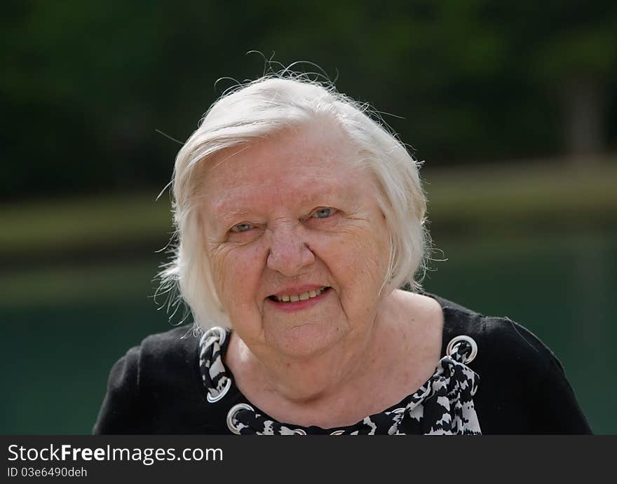 Portrait of old woman outside during day. Portrait of old woman outside during day