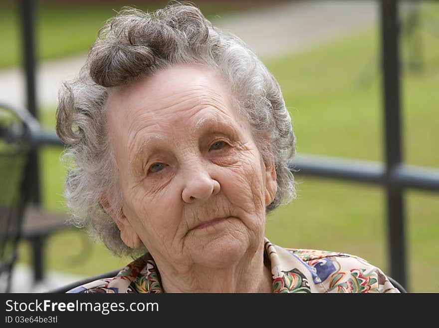 Portrait of elderly woman outside during day. Portrait of elderly woman outside during day