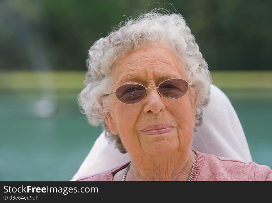 Portrait of elderly woman outside during the day. Portrait of elderly woman outside during the day