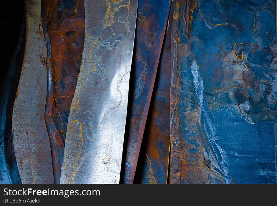 Rusted steel sheets and pieces in a workshop