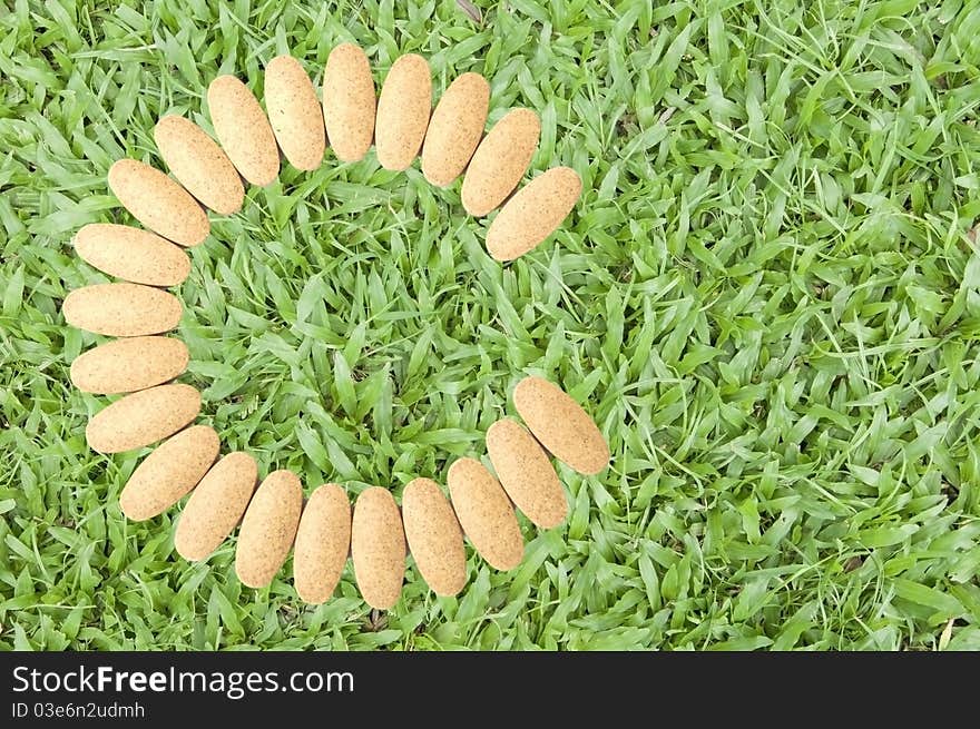 Vitamin c as green grass background