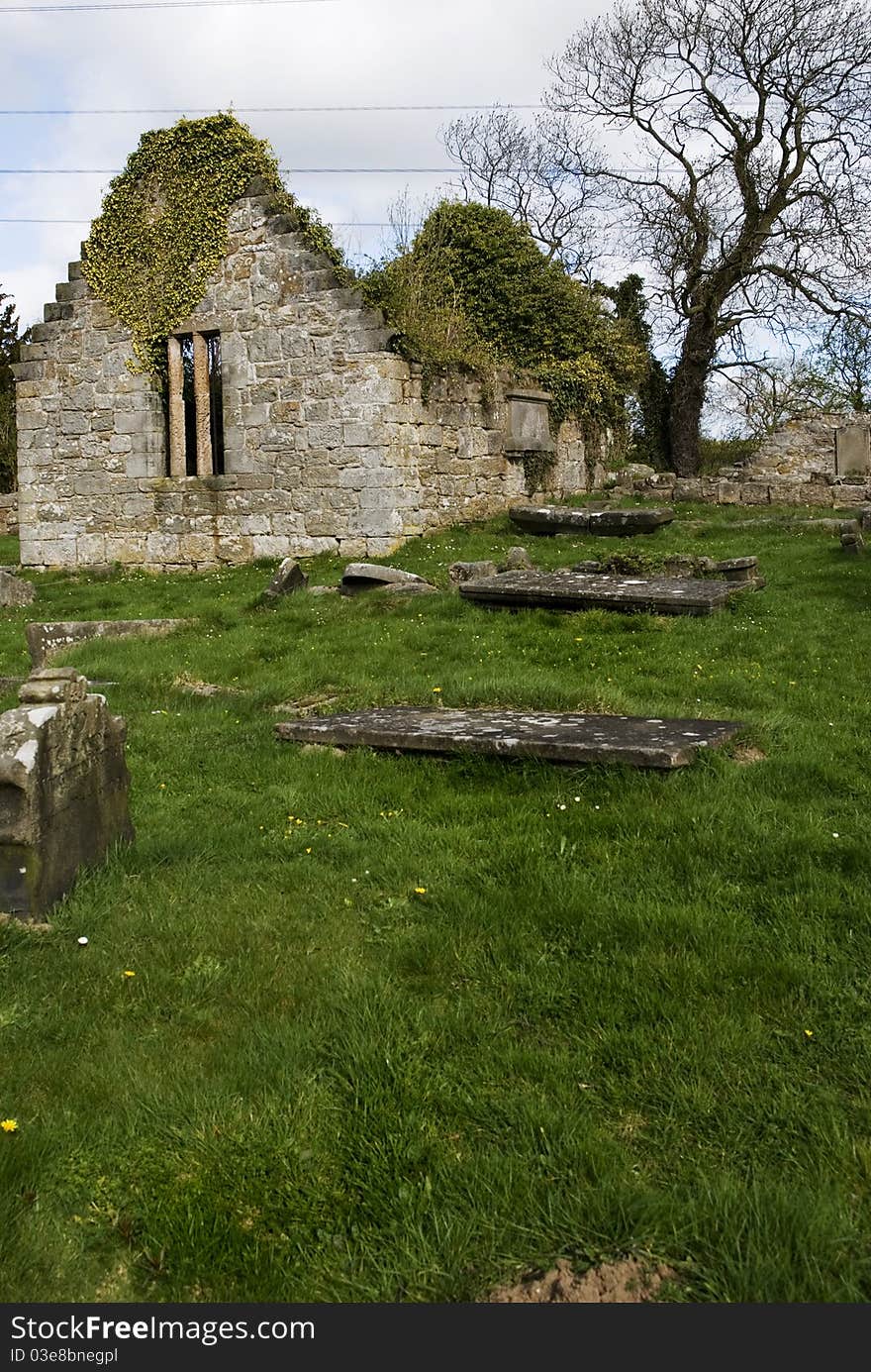 A vertical image of the old west kirk in culross scotland on a sunny spring morning. A vertical image of the old west kirk in culross scotland on a sunny spring morning