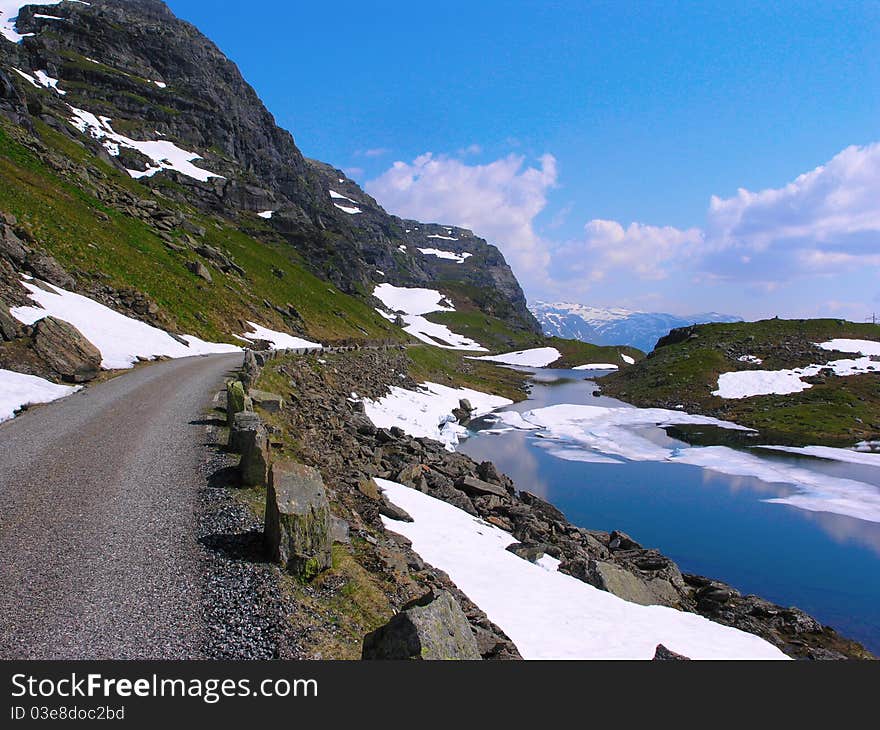 Road passing by the lakes at the norwegian mountains. Road passing by the lakes at the norwegian mountains