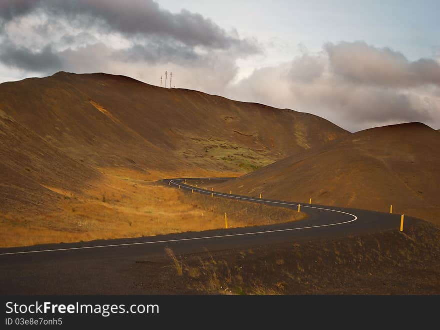 Winding mountain road next to Myvatn in north of Iceland. Winding mountain road next to Myvatn in north of Iceland