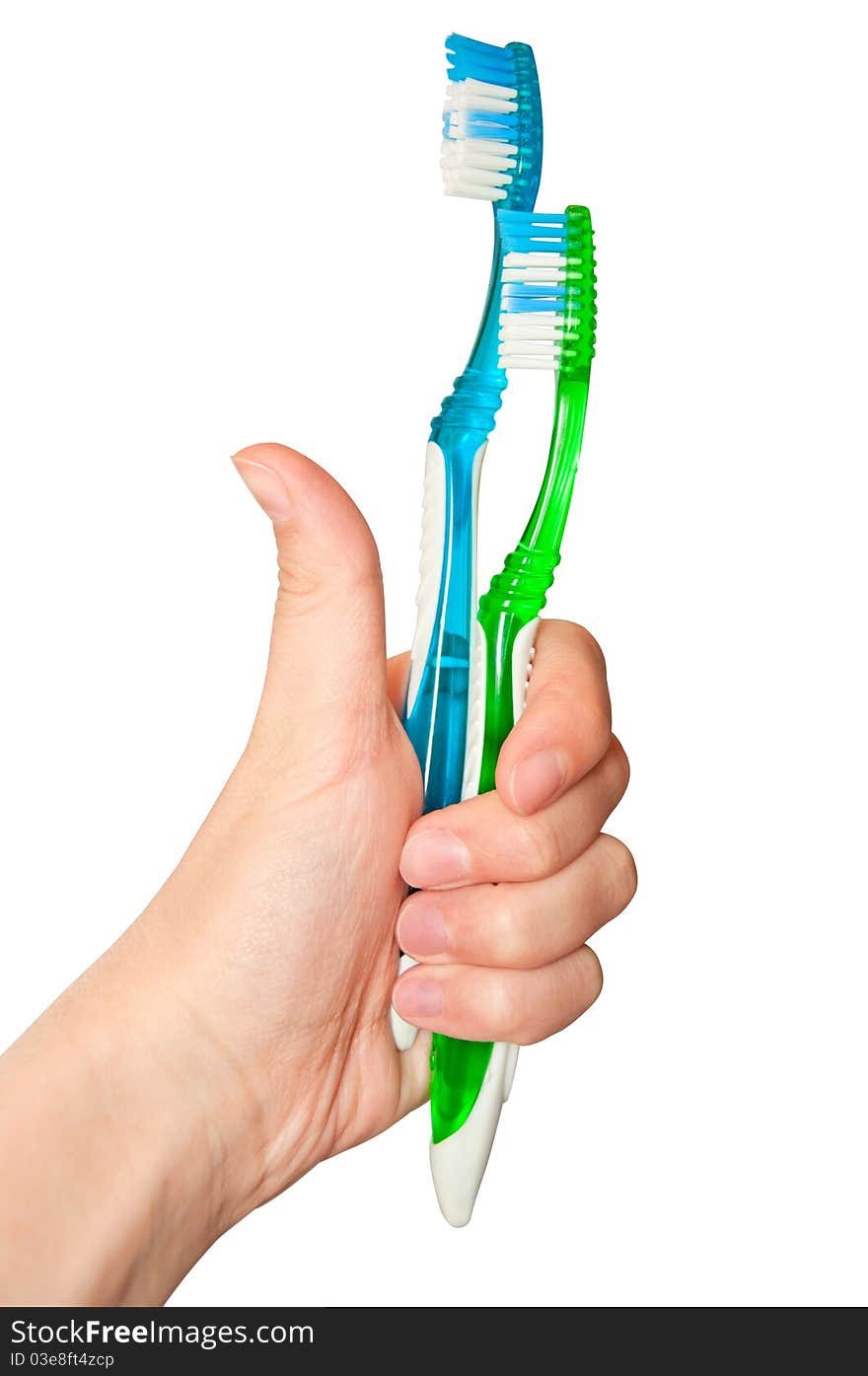 Two isolated tooth brushes holding by hand