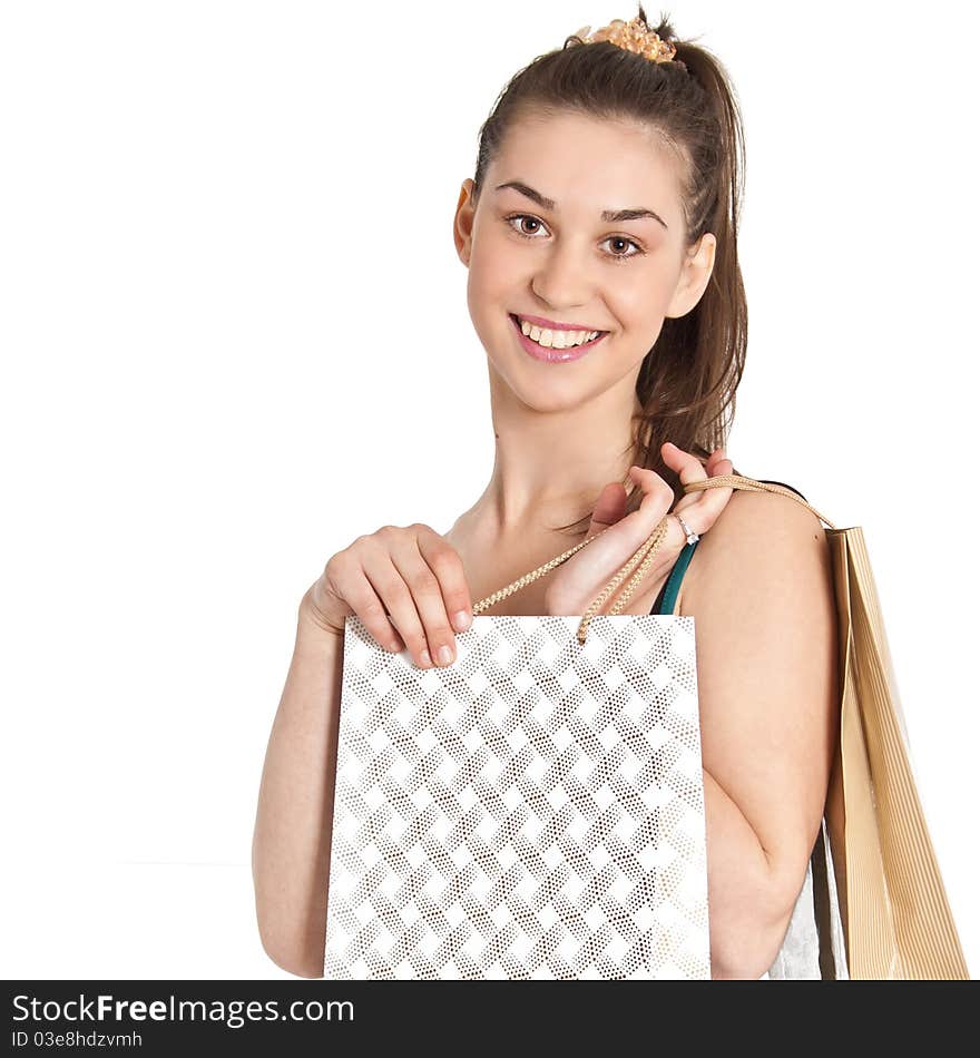 Beautiful girl with shopping bags over white background. Beautiful girl with shopping bags over white background