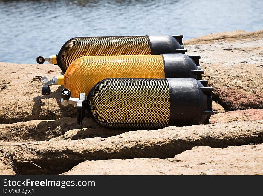 Diver tanks, sea, rocks