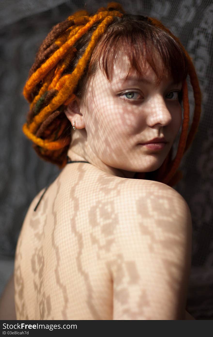 Art portrait of a girl with dreadlocks