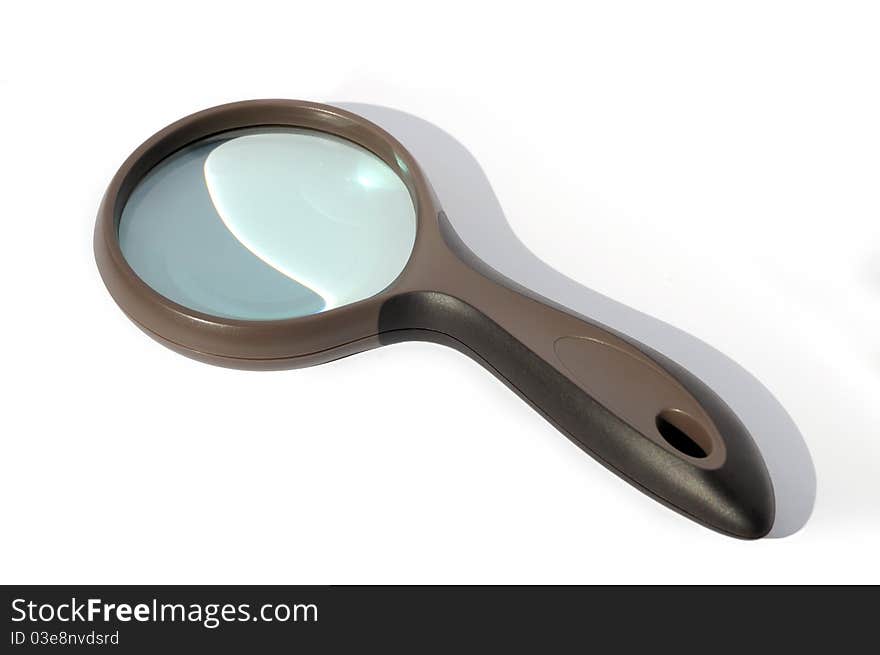 Magnifying glass over white background