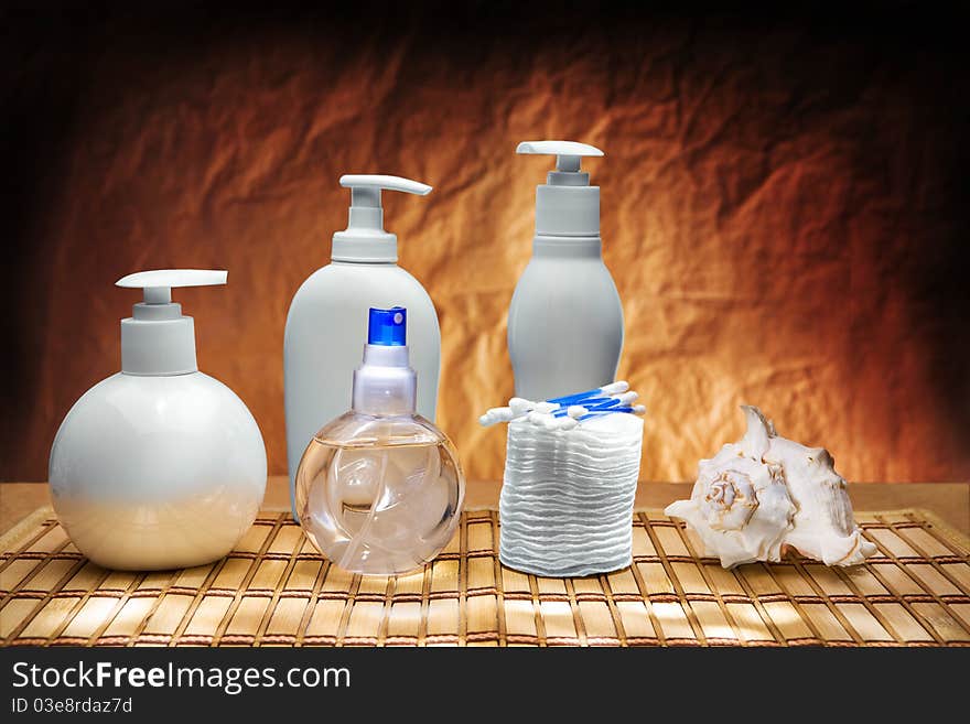 Composition of skincare items on wooden mat. Composition of skincare items on wooden mat