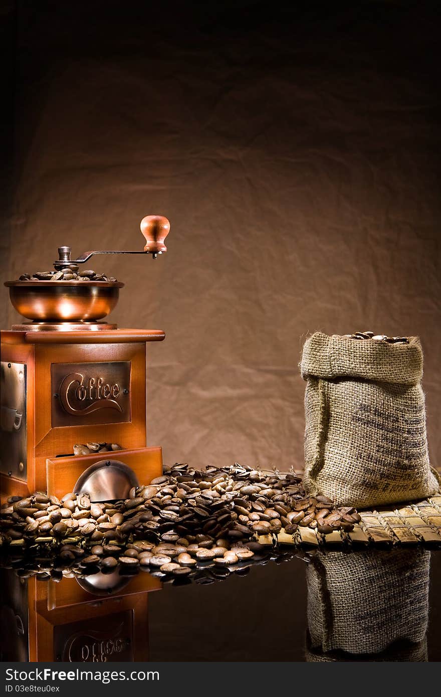 Mill and bag with coffee beans