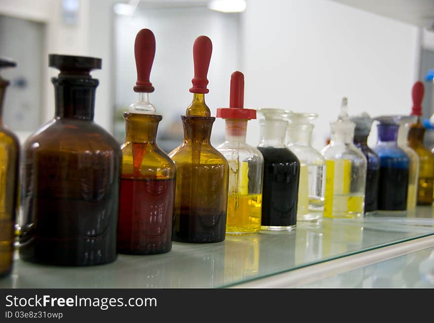 Testing tubes on shelf in a lab. Testing tubes on shelf in a lab