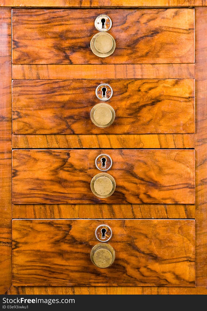 Wooden cabinet with closed drawer