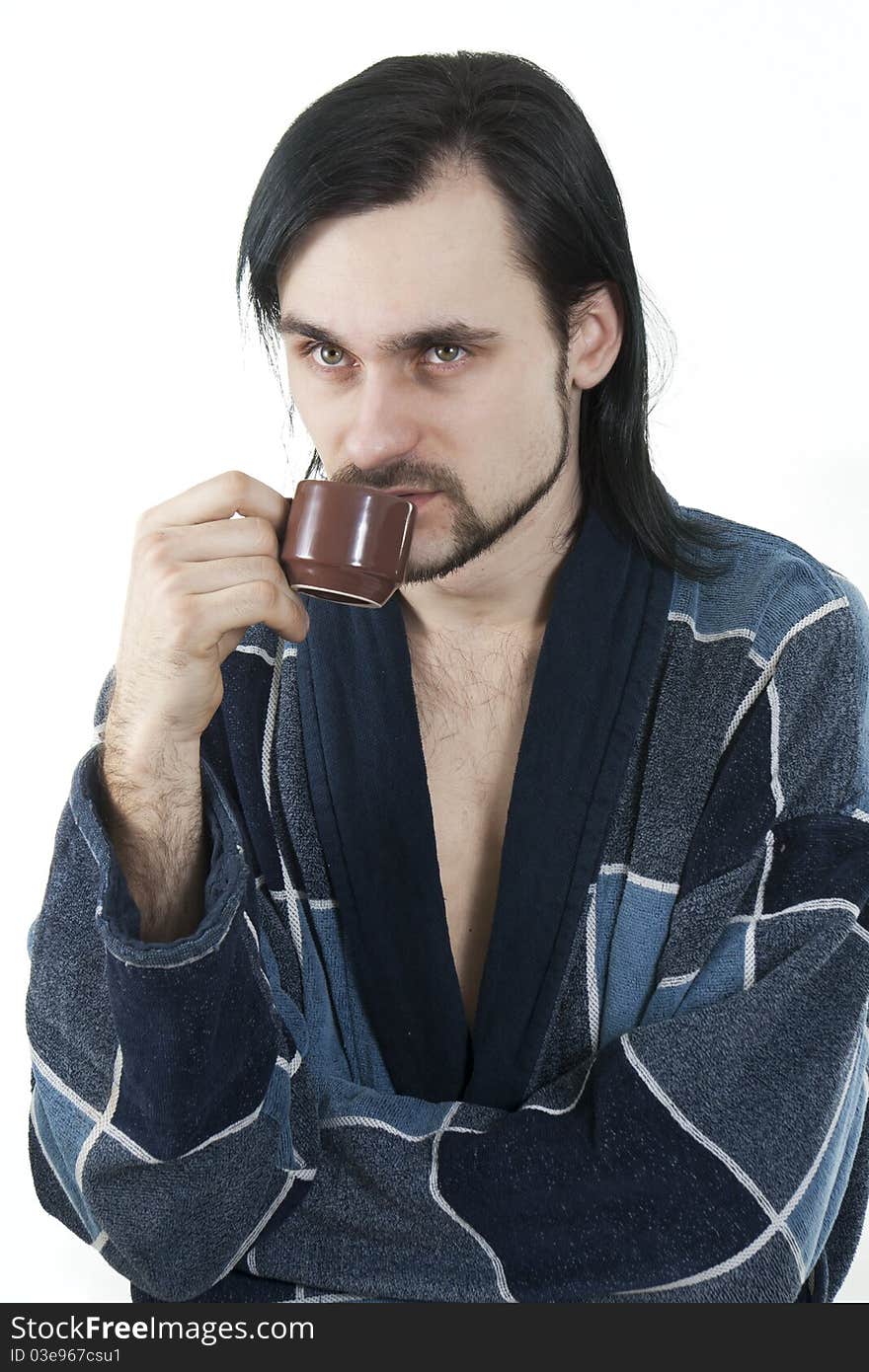 Sleepy man in housecoat with little cup of coffee. Sleepy man in housecoat with little cup of coffee