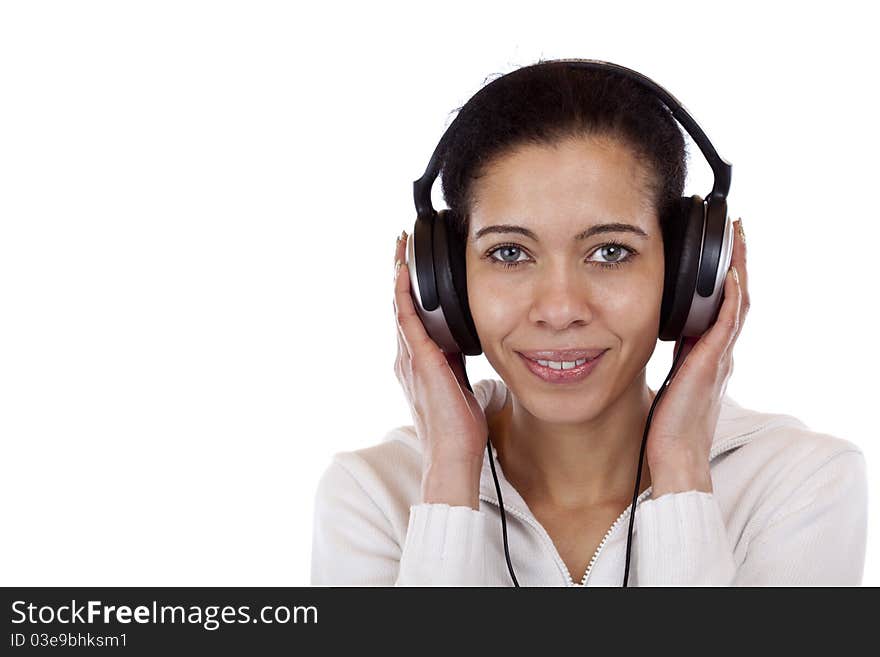 Beautiful, happy woman with headphones listens to mp3 music. Isolated on white background.