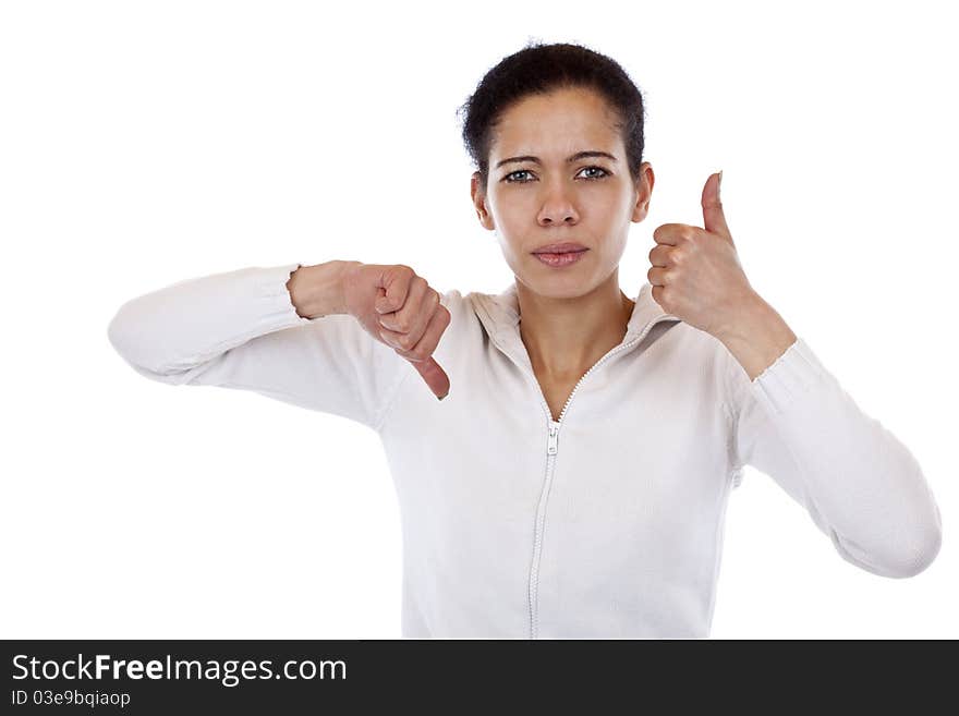 Woman is undecided and shows thumb up and down. Isolated on white background.