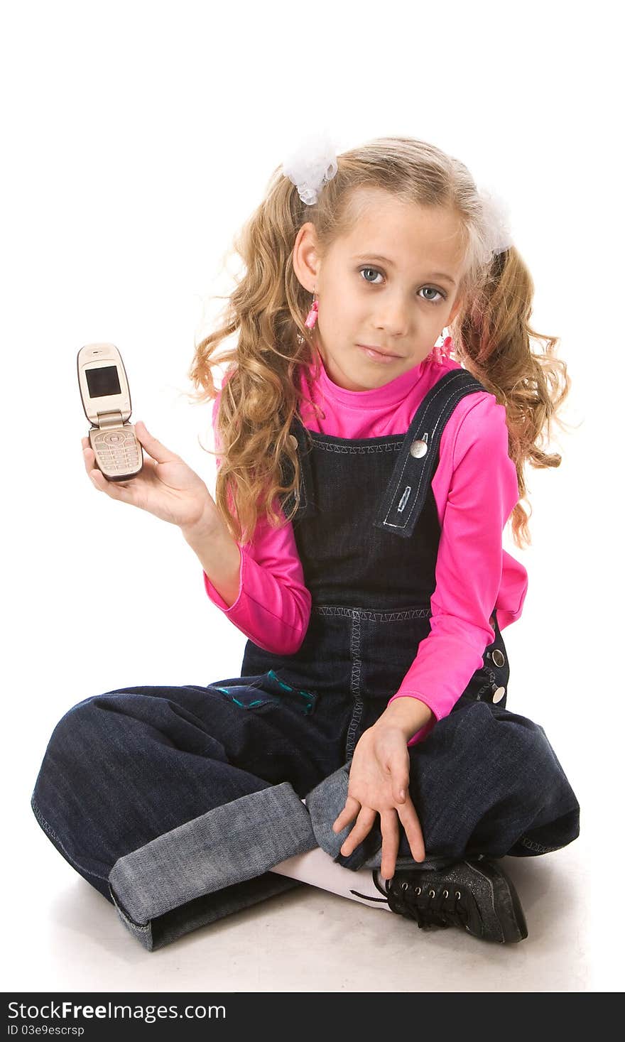 Young beautiful girl showing her new mobile phone. Young beautiful girl showing her new mobile phone.