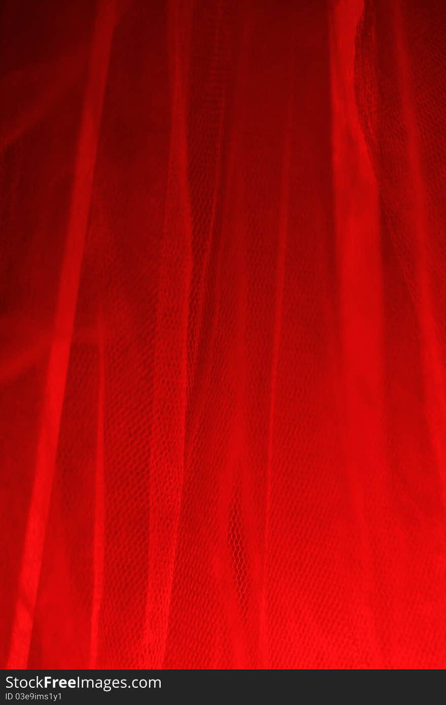 Red light is reflected through the gauze curtain. Red light is reflected through the gauze curtain