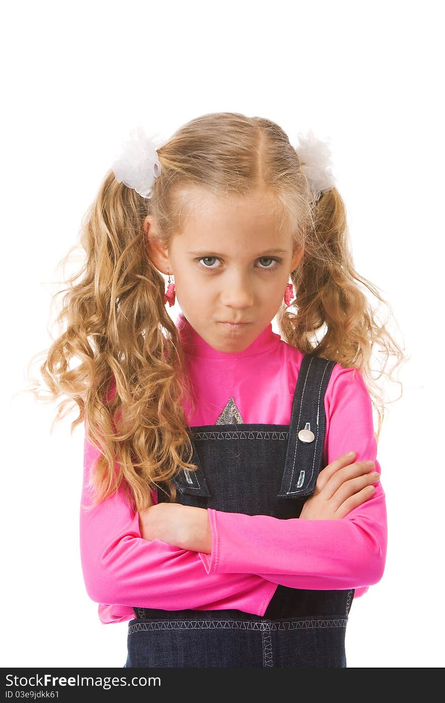 Young girl looking upset with her arms crossed