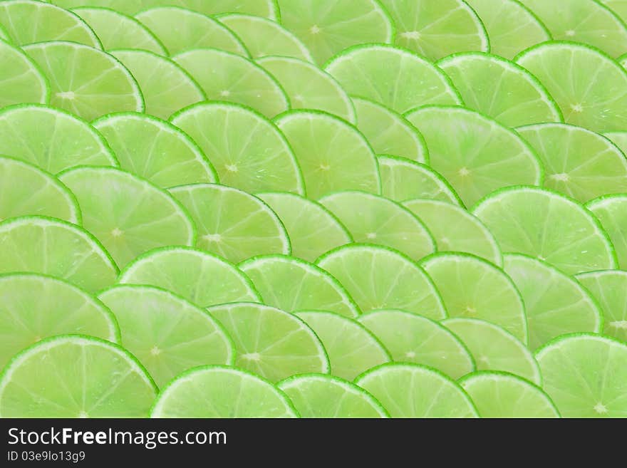 Limes slices forming scale background. Limes slices forming scale background