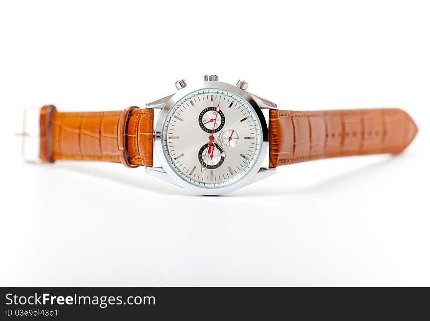 Men's metal wristwatch on the white