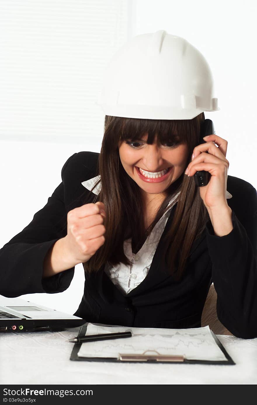 Girl Sitting In The Construction Helmet