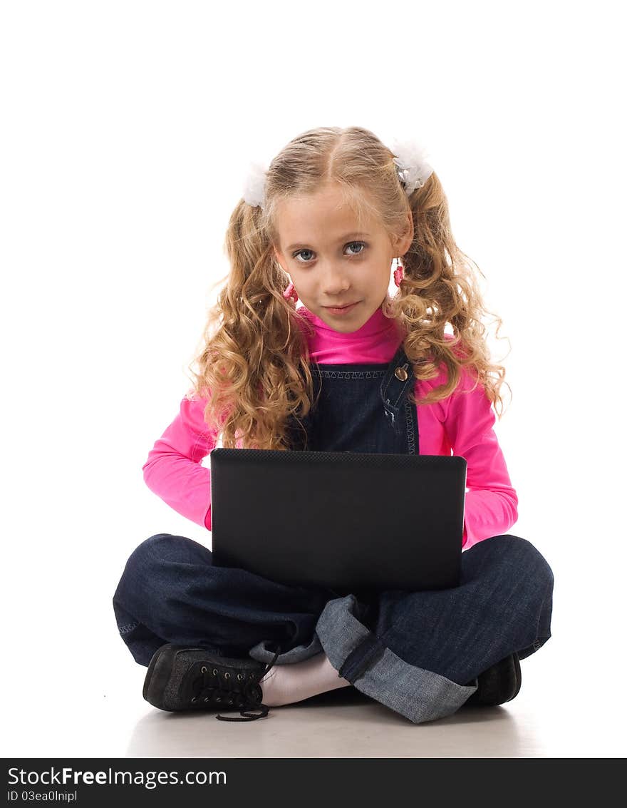 Young girl typing something on her own laptop. Young girl typing something on her own laptop