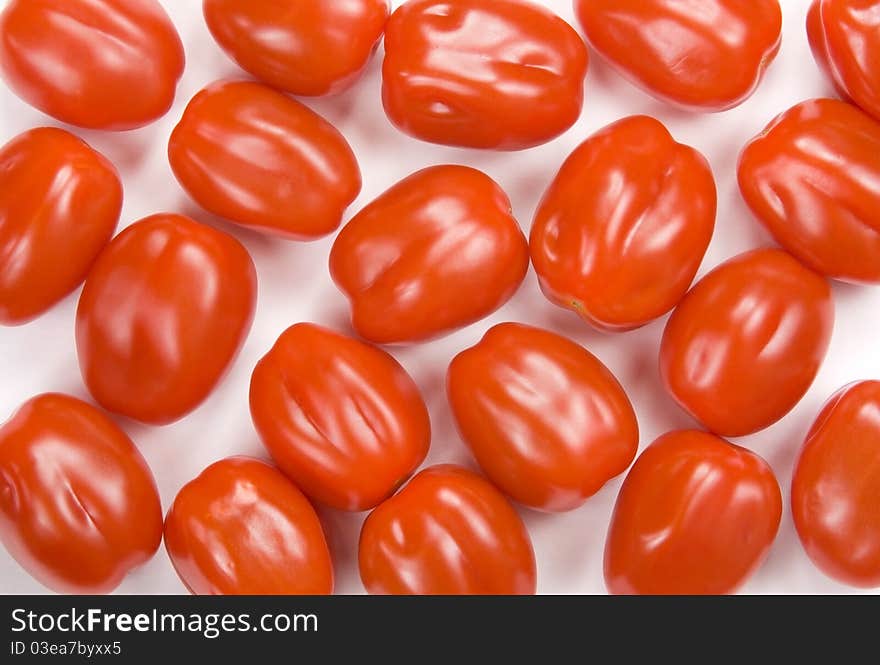 Red cherry tomatoes on the white background