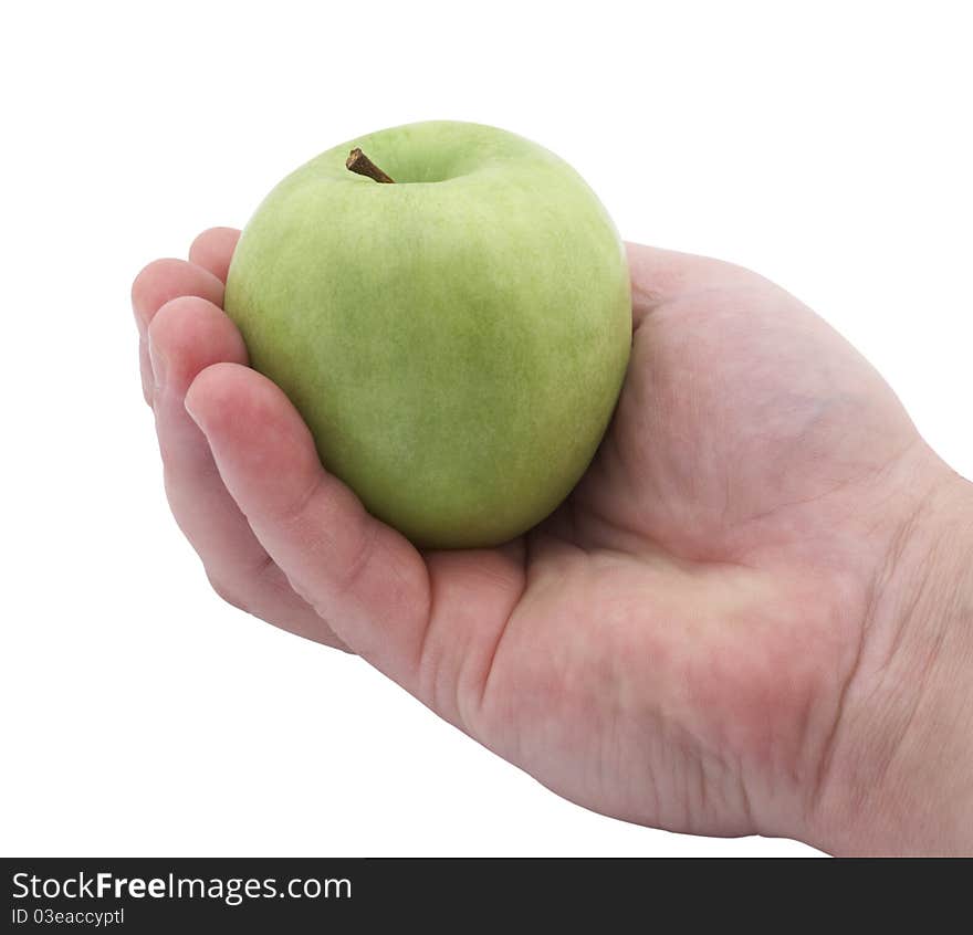 Green apple in hand, isolated on a white background