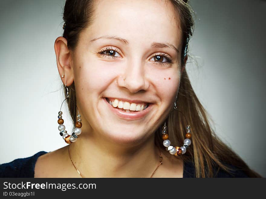 Portrait of elegant beautiful woman wearing jewelry.