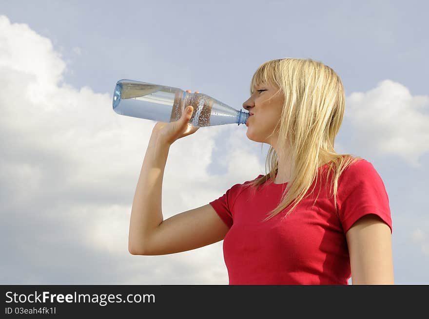 Young woman drinking water