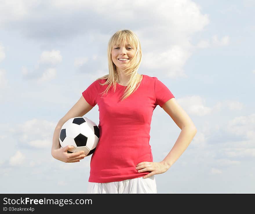 Young woman with soccer ball